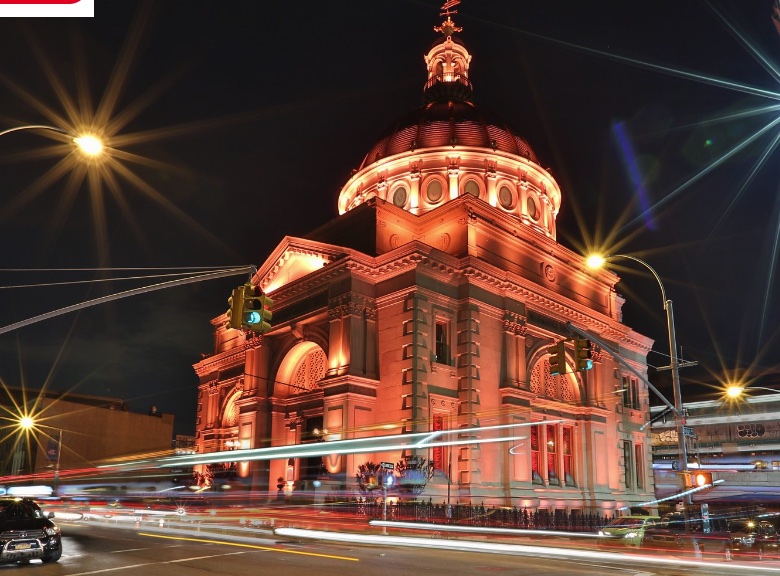 Williamsburg Savings Bank illuminated red at night